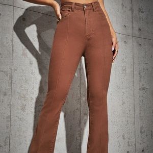 Burnt red colored flare jeans